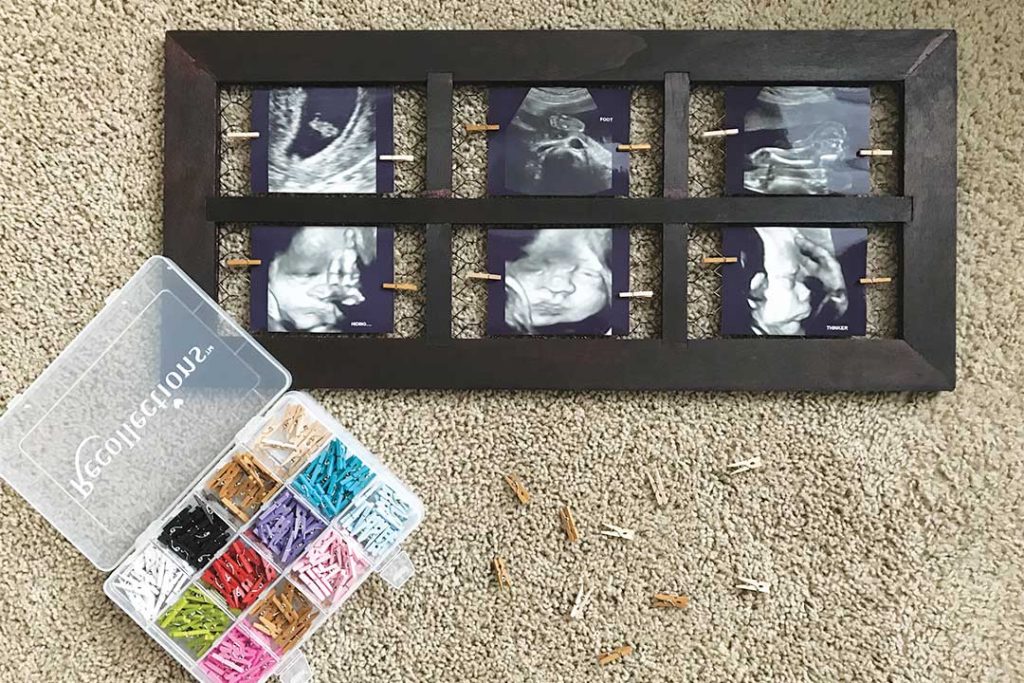 ultrasound pictures attached to chicken wire with mini clothespins