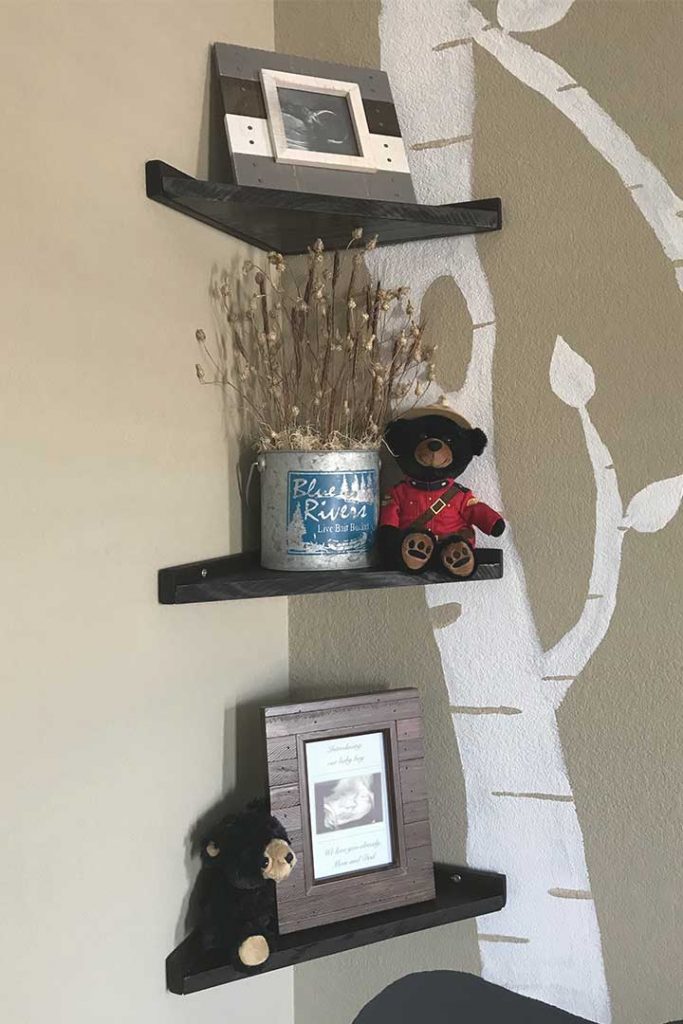 DIY floating corner shelves decorated for a woodland nursery