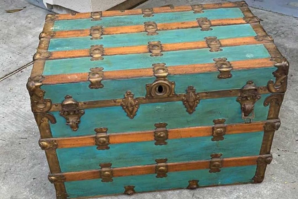 antique metal-clad steamer trunk painted turquoise