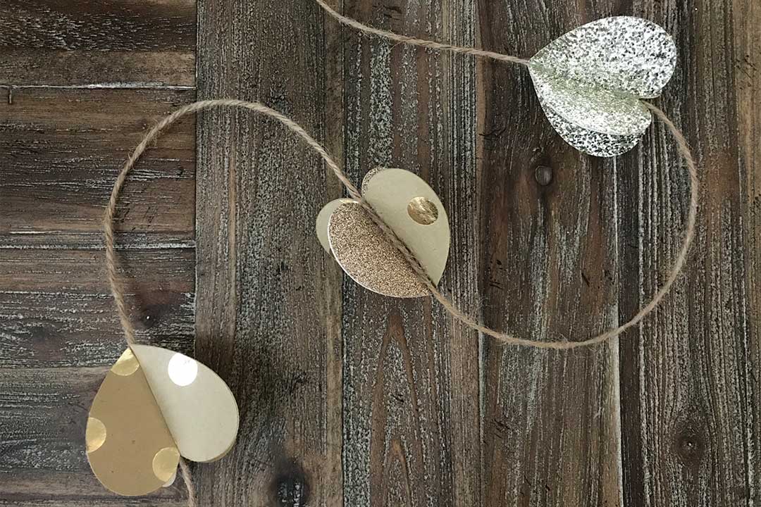 3D glitter and neutral tone hearts attached to twine with glue