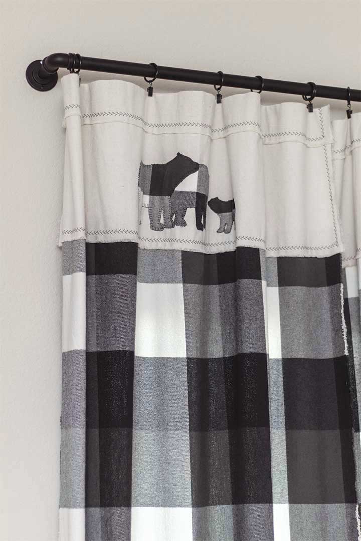 woodland nursery curtains made of black and white buffalo check flannel, drop cloth, and bear appliques