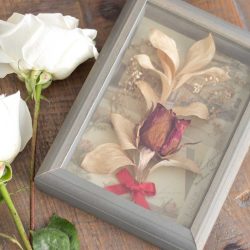 diy dried red rose flower shadow box on a farmhouse table with fresh white roses