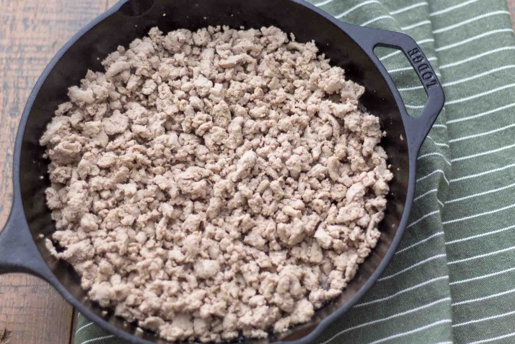 fully cooked ground turkey in a cast iron skillet