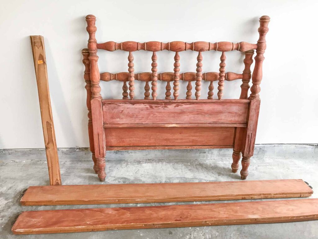 photo of an antique jenny lind bed that has already been stripped of its original finish before refinishing