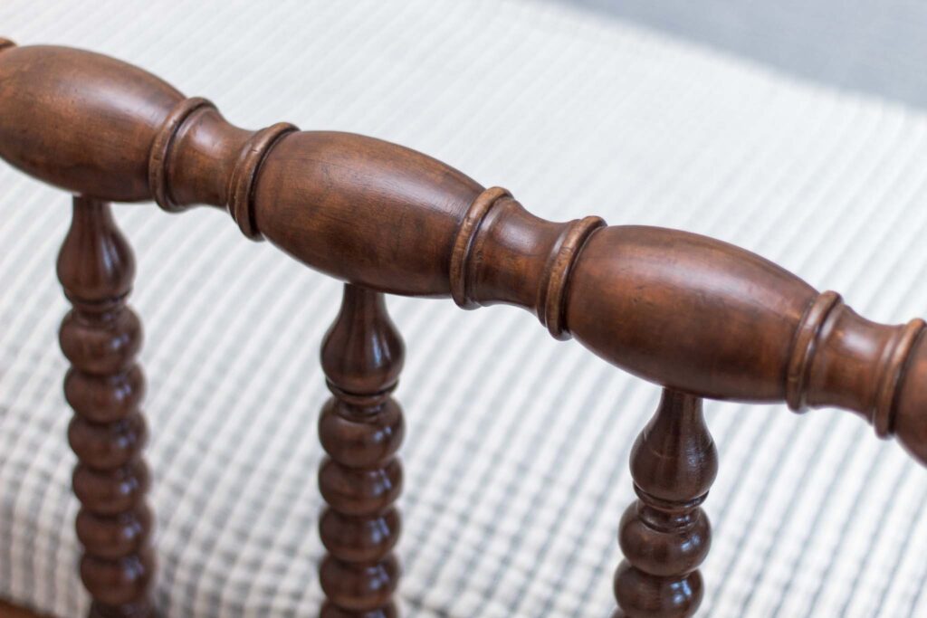 close-up of refinished spindles on an antique jenny lind bed