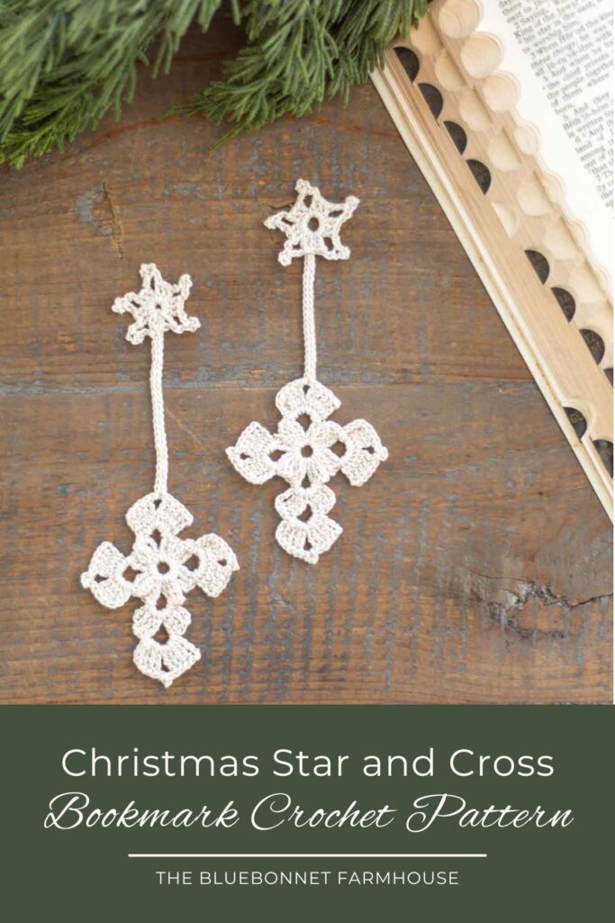 two antique white crochet Christmas star and cross bookmarks on a reclaimed wood farmhouse table next to a vintage bible and cedar greenery. text reads "Christmas star and cross bookmark crochet pattern - the bluebonnet farmhouse"