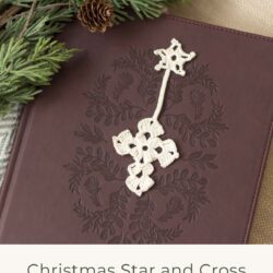 antique white crochet thread Christmas star and cross bookmark on top of a dark brown leather bible with cedar greenery and pine cones next to it on a beige couch with woven neutral blanket. text reads "Christmas star and cross bookmark crochet pattern - the bluebonnet farmhouse"